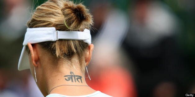 London, UNITED KINGDOM: Picture of Italian Mara Santangelo's tattoo during the first round of the Wimbledon Tennis Championships in Wimbledon, in south London, 27 June 2007. AFP PHOTO / JOE KLAMAR (Photo credit should read JOE KLAMAR/AFP/Getty Images)