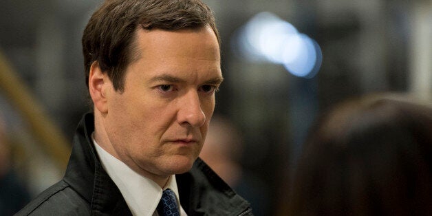 LLANTRISANT, UNITED KINGDOM - MARCH 25: Chancellor George Osborne is seen during a visit to the Royal Mint to see how it has been affected by the budget on March 25, 2014 in Llantrisant, Wales. In the Chancellor's budget statement last week he announced a new design for a 12-sided one pound coin which is designed to be much harder to fake and is based on the pre-decimal 'threepenny bit' three pence piece. (Photo by Matthew Horwood - WPA Pool/Getty Images)