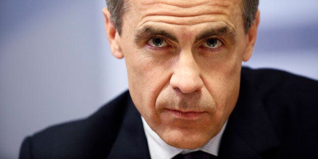 Mark Carney, governor of the Bank of England, pauses during the central bank's quarterly inflation report news conference at the Bank of England in London, U.K., on Wednesday, May 14, 2014. The Bank of England signaled it's willing to wait until next year to raise interest rates even as the U.K. economy strengthens and the amount of spare capacity narrows. Photographer: Simon Dawson/Bloomberg via Getty Images