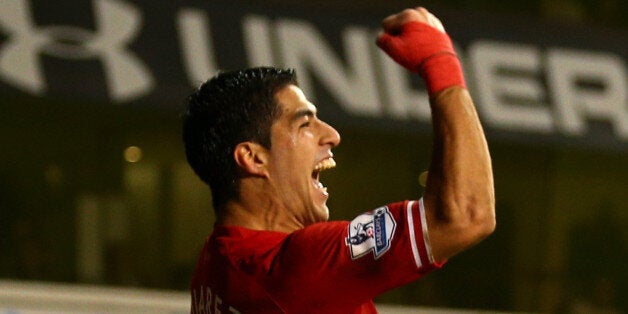 LONDON, ENGLAND - DECEMBER 15: Luis Suarez of Liverpool celebrates scoring their fourth goal during the Barclays Premier League match between Tottenham Hotspur and Liverpool at White Hart Lane on December 15, 2013 in London, England. (Photo by Paul Gilham/Getty Images)