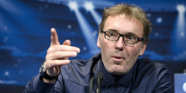 Paris Saint-Germain coach Laurent Blanc gives a press conference at the Parc des Princes stadium in Paris on November 26, 2013, on the eve of the UEFA Champions League football match against Olympiakos. After failing to get the job done in their last group game, Paris Saint-Germain will seek the draw required to qualify for the Champions League last 16 when they host a Kostas Mitroglou-inspired Olympiakos. AFP PHOTO / FRANCK FIFE (Photo credit should read FRANCK FIFE/AFP/Getty Images)