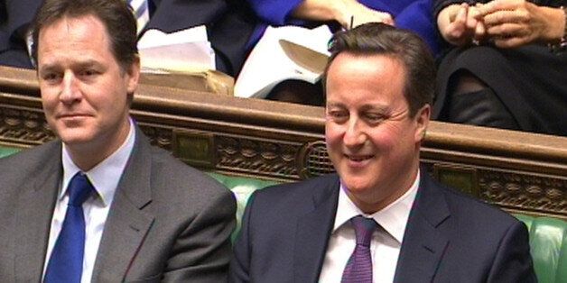 Deputy Prime Minister Nick Clegg and Prime Minister David Cameron during Prime Minister's Questions in the House of Commons, London.