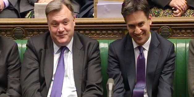 Shadow Chancellor Ed Balls (left) and Labour party leader Ed Miliband listen during Prime Minister's Questions in the House of Commons, London.