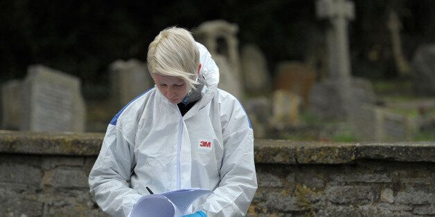 A Forensic officer at the scene at Great Western Cemetery by All Saints' Church in Didcot, Oxfordshire, as Thames Valley Police announced that they are to focus their investigation into the disappearance of 17 -year-old Jayden Parkinson on a specific grave.
