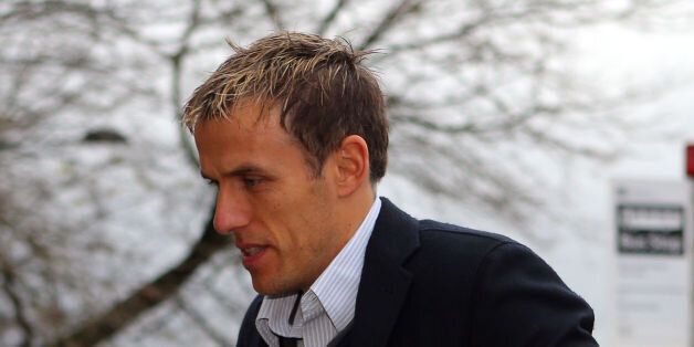 Phil Neville, son of Neville Neville, arrives at Bolton Crown Court where he faces charges of sexual assault against a woman who had offered him a lift home following a night out.