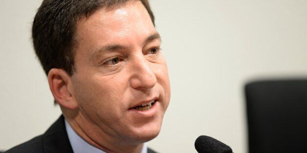 The Guardian's Brazil-based reporter Glenn Greenwald, who was among the first to reveal Washington's vast electronic surveillance program testifies before the investigative committee of the Senate that examines charges of espionage by the United States in Brasilia on October 9, 2013, following press reports of US electronic surveillance in Brazil based on leaks from Edward Snowden, a former US National Security Agency contractor. AFP PHOTO/Evaristo Sa (Photo credit should read EVARISTO SA/AFP/Getty Images)