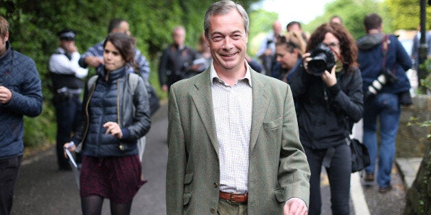 BIGGIN HILL, UNITED KINGDOM - MAY 22: United Kingdom Independence Party (UKIP) leader Nigel Farage walks home after voting at a polling station on May 22, 2014 near Biggin Hill, England. Millions of voters are going to the polls today in local and European elections. (Photo by Peter Macdiarmid/Getty Images)