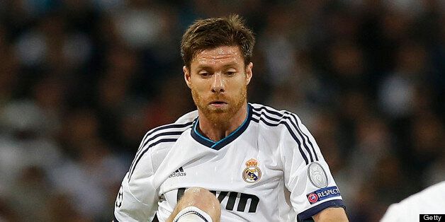 MADRID, SPAIN - APRIL 30: Xabi Alonso of Real Madrid controls the ball during the UEFA Champions League Semi Final second leg match between Real Madrid and Borussia Dortmund at Estadio Santiago Bernabeu on April 30, 2013 in Madrid, Spain. (Photo by Helios de la Rubia/Real Madrid via Getty Images)