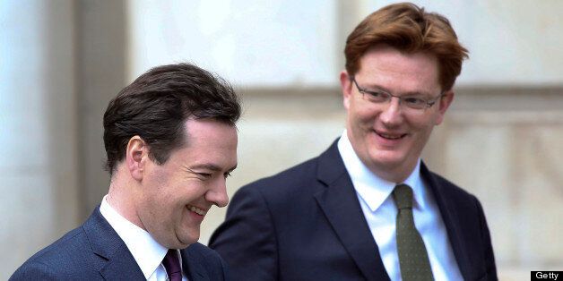 George Osborne, U.K. chancellor of the exchequer, left, reacts with Danny Alexander, U.K. chief secretary to the treasury, as they leave the HM Treasury building for the Houses of Parliament in London, U.K., on Wednesday, Dec. 5, 2012. Osborne faces the prospect of breaching his self-imposed budget rules as an economy struggling to escape recession drives debt higher and erodes his political capital. Photographer: Chris Ratcliffe/Bloomberg via Getty Images
