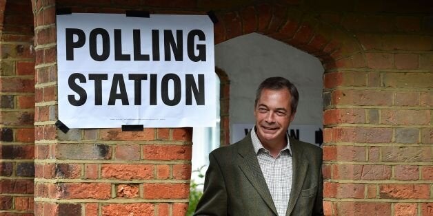 United Kingdom Independence Party (UKIP) leader Nigel Farage poses for photographs near Biggin Hill, south of London, before voting in the local and European elections on May 22, 2014. Europe's mammoth parliamentary elections kicked off on Thursday, with Britain and the Netherlands going to the polls in a vote that is expected to see a swing towards populist right-wing parties. The elections, which are spread over four days in the EU's 28 member states, are expected to see major gains for partie