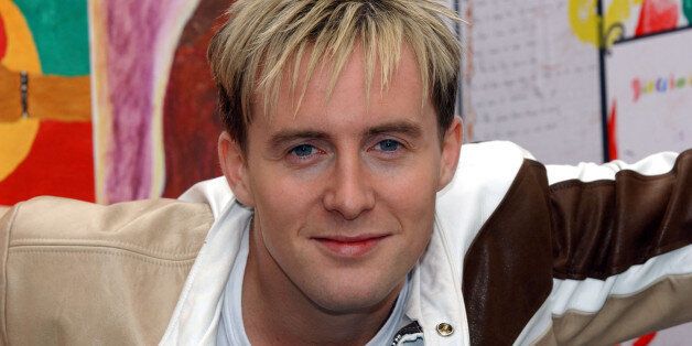 Ian 'H' Watkins, from the pop group Steps, during a photocall in London, to launch Save the Children's Seriously Big Book. The giant book measuring 6ft x 4ft, contains powerful artwork sent in by children from the UK and over 36 countries world-wide. * The book will be sent by Save the Children to the United Nations Special Session on Children, which takes place in New York on September 19 - 21st.
