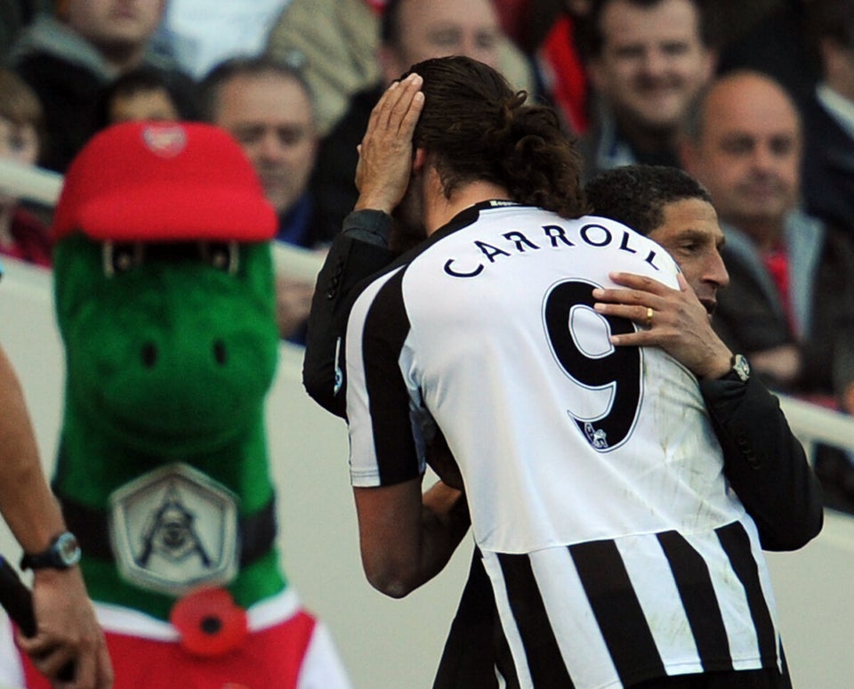 Arsenal's mascot "Gunnersaurus" "looks o