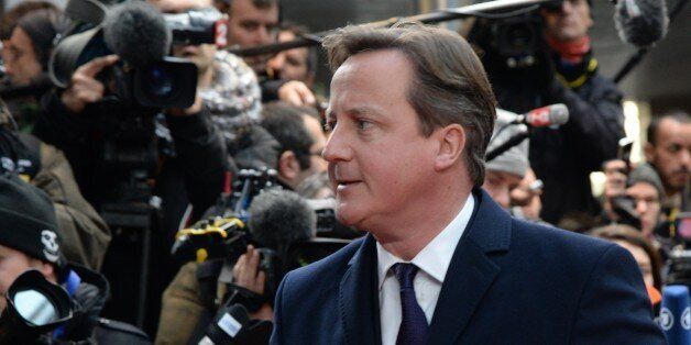 British Prime Minister David Cameron arrives to take part in an EU summit focused on the common security, Defence policy and Economic and Monetary union, in Brussels on December 19, 2013. The European Union took a historic leap towards greater integration just hours ahead of a summit today, with a deal on a banking union to prevent a re-run of the eurozone's recent crisis. AFP PHOTO / THIERRY CHARLIER (Photo credit should read THIERRY CHARLIER/AFP/Getty Images)