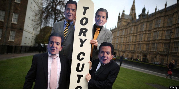 LONDON, ENGLAND - DECEMBER 05: Members of the UNISON union wear masks depicting Chancellor George Osborne as they protest against budget cuts near Parliament on December 5, 2012 in London, England. The Chancellor George Osborne is expected to say that there is no miracle cure for the United Kingdom's financial woes as the economy struggles for growth when he delivers his Autumn Statement later in Parliament. (Photo by Peter Macdiarmid/Getty Images)