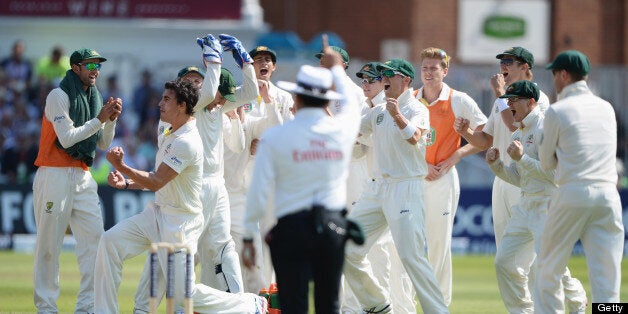 NOTTINGHAM, ENGLAND - JULY 11: Mitchell Starc of Australia celebrates the wicket of Jonathan Trott of England with team mates during day two of the 1st Investec Ashes Test match between England and Australia at Trent Bridge Cricket Ground on July 11, 2013 in Nottingham, England. (Photo by Gareth Copley/Getty Images)