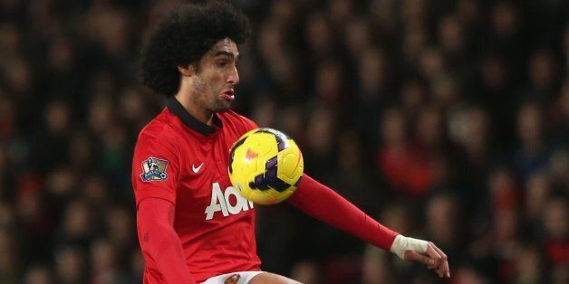 MANCHESTER, ENGLAND - DECEMBER 04: Marouane Fellaini of Manchester United in action during the Barclays Premier League match between Manchester United and Everton at Old Trafford on December 4, 2013 in Manchester, England. (Photo by John Peters/Man Utd via Getty Images)