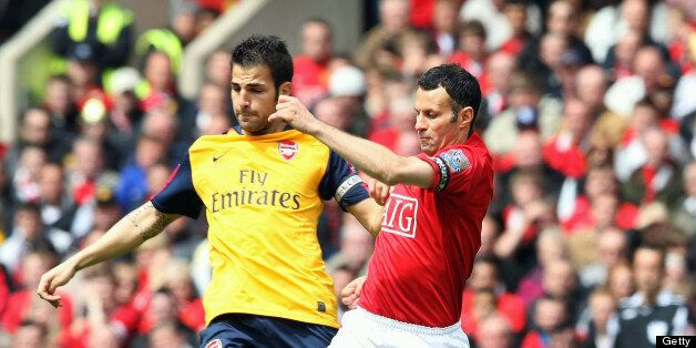 MANCHESTER, ENGLAND - MAY 16: Ryan Giggs of Manchester United clashes with Cesc Fabregas of Arsenal during the Barclays Premier League match between Manchester United and Arsenal at Old Trafford on May 16 2009, in Manchester, England. (Photo by Matthew Peters/Manchester United via Getty Images)