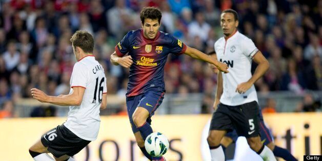 Cesc Fabregas (C) of Barcelona vies for the ball with Michael Carrick (L) and Rio Ferdinand (R) of Manchester during the friendly football match between Barcelona FC and Manchester United at Ullevi Stadium in Gothenburg on August 8, 2012. AFP PHOTO / SCANPIX-SWEDEN / BJORN LARSSON ROSVALL ***SWEDEN OUT*** (Photo credit should read BJORN LARSSON ROSVALL/AFP/GettyImages)