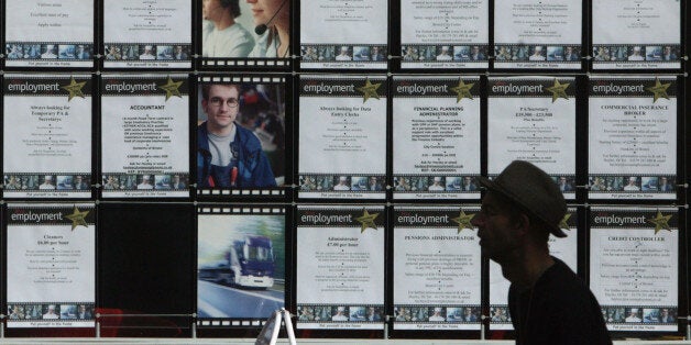 BRISTOL, UNITED KINGDOM - MARCH 18: People pass a vacancy signs in the window of a recruitment job shop on March 18 2009 in Bristol, England. Official figures published today show that UK unemployment has risen above two million for the first time since 1997 - and according to the TUC, there are now 10 jobseekers for every vacancy advertised in UK jobcentres, with many economists predicting it will go above three million mark next year. (Photo by Matt Cardy/Getty Images)