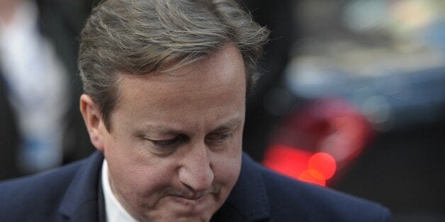 British Prime Minister David Cameron arrives to take part in an EU summit focused on the common security, Defence policy and Economic and Monetary union, in Brussels on December 19, 2013. The European Union took a historic leap towards greater integration just hours ahead of a summit today, with a deal on a banking union to prevent a re-run of the eurozone's recent crisis. AFP PHOTO / ALAIN JOCARD (Photo credit should read ALAIN JOCARD/AFP/Getty Images)