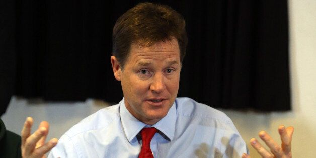 Deputy Prime Minister Nick Clegg talks to youngsters as he helps to launch a scheme to give 16 and 17-year-olds access to work coaches to help them find jobs and training at St Andrews Youth Club, in central London.