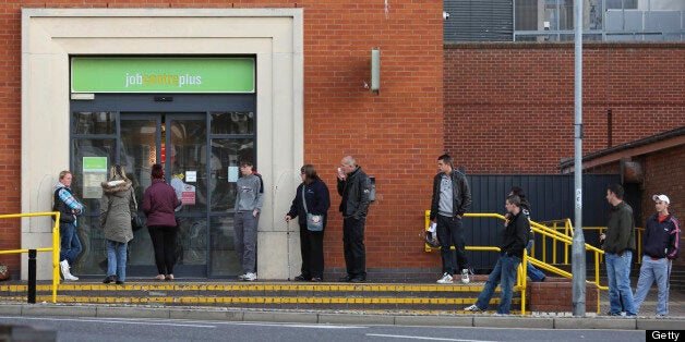 Jobseekers queue outside a job centre plus in Great Yarmouth, U.K., on Tuesday, Oct. 9, 2012. U.K. Chancellor of the Exchequer George Osborne said staff at small and medium-sized companies will be given the chance to give up their employment rights in exchange for shares in their firms, which will be exempt from tax. Photographer: Chris Ratcliffe/Bloomberg via Getty Images