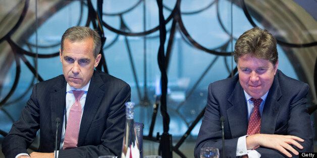 Mark Carney, governor of the Bank of England, left, and Paul Tucker, outgoing deputy governor at the Bank of England, listen during a monetary policy committee (MPC) briefing meeting inside the central bank's headquarters in London, U.K., on Monday, July 1, 2013. Carney takes the Bank of England helm today facing a struggle to make his policies count more than those of his U.S. counterpart for U.K. government debt. Photographer: Jason Alden/Pool/Bloomberg via Getty Images