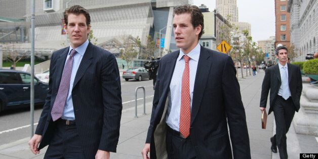 SAN FRANCISCO - JANUARY 11: Cameron (C) and Tyler Winklevoss (L) leave the U.S. Court of Appeals on January 11, 2011 in San Francisco, California. Twin brothers and former Harvard University classmates Cameron and Tyler Winklevoss are requesting that a three-judge panel of the U.S. Court of Appeals in San Francisco to void a 2008 agreement to pay the twins $65 million citing that Facebook did not give an accurate valuation of its shares before agreeing to pay the settlement. (Photo by Justin S