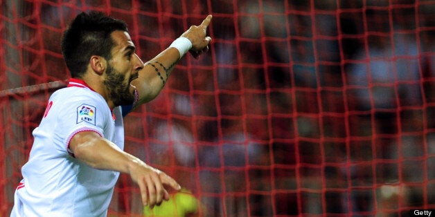 Sevilla's forward Alvaro Negredo reacts during the Spanish league football match Sevilla FC vs Atletico de Madrid at the Ramon Sanchez Pizjuan in Sevilla on April 21, 2013. Atletico de Madrid won the match 1-0. AFP PHOTO / CRISTINA QUICLER (Photo credit should read CRISTINA QUICLER/AFP/Getty Images)