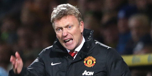 NORWICH, ENGLAND - DECEMBER 28: Manager David Moyes of Manchester United watches from the touchline during the Barclays Premier League matche between Norwich City and Manchester United at Carrow Road on December 28, 2013 in Norwich, England. (Photo by John Peters/Man Utd via Getty Images)