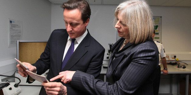 Prime Minister David Cameron and Home Secretary Theresa May visits UK Border Agency staff at Terminal 5 of Heathrow Airport, Middlesex, where they were shown differences between fake and real passports.