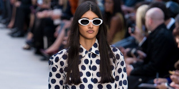 LONDON, ENGLAND - SEPTEMBER 16: Model Neelam Johal walks the runway at the Burberry Prorsum show at London Fashion Week SS14 at Kensington Gardens on September 16, 2013 in London, England. (Photo by Ian Gavan/Getty Images)