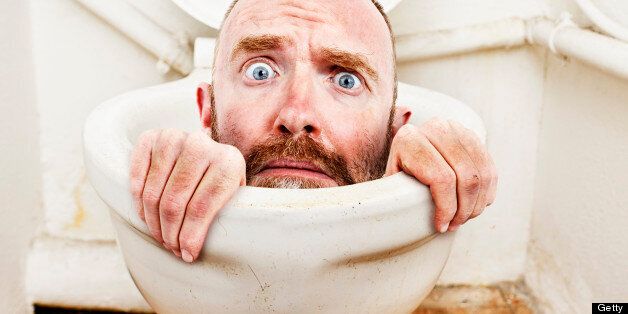 A desperate-looking man tries to claw his way out of a toilet bowl in this bizarre and humorous montage, symbolic of all kinds of problems.