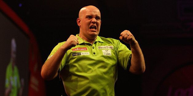 LONDON, ENGLAND - JANUARY 01: Michael van Gerwen celebrates defeating Peter Wright of Scotland and winning the final of the Ladbrokes.com World Darts Championships at Alexandra Palace on January 1, 2014 in London, England. (Photo by Ben Hoskins/Getty Images)
