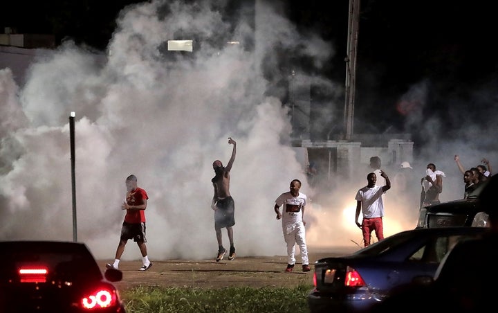 Dozens of protesters clashed with police, throwing stones and tree limbs until police forces broke up the demonstration with