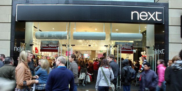 File photo dated 29/12/2008 of a branch of High street fashion chain Next which upped its annual profits forecast for the third time in five months today as it thanked better ranges and a welcome improvement in consumer confidence.