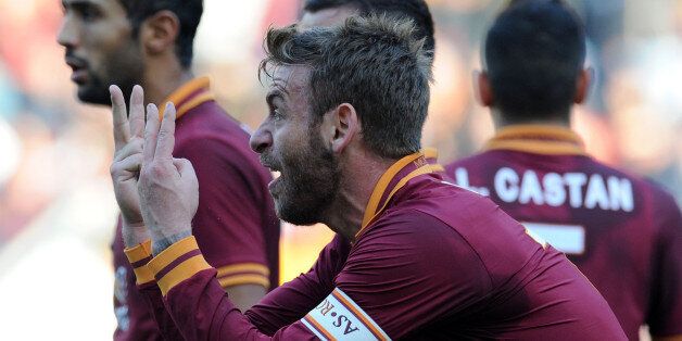 ROME, ITALY - DECEMBER 08: Daniele De Rossi of Roma gestures during the Serie A match between AS Roma and ACF Fiorentina at Stadio Olimpico on December 8, 2013 in Rome, Italy. (Photo by Giuseppe Bellini/Getty Images)