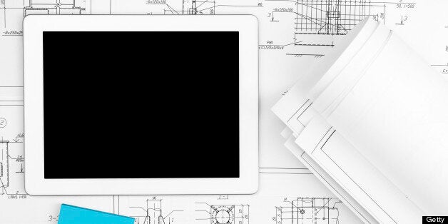 Digital Tablet, blueprints and sticker in office