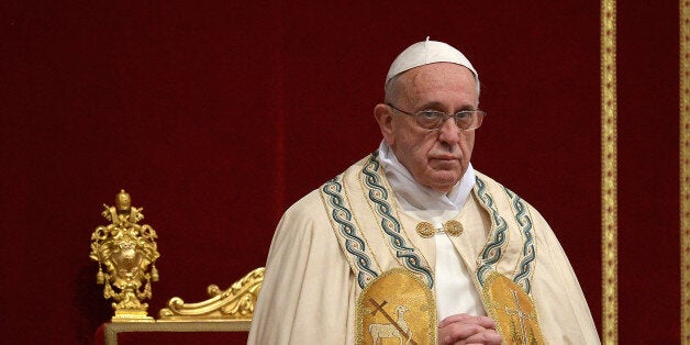 Pope Francis celebrates the First Vespers and Te Deum prayers in Saint Peter's Basilica in the Vatican on December 31, 2013. AFP PHOTO / FILIPPO MONTEFORTE (Photo credit should read FILIPPO MONTEFORTE/AFP/Getty Images)