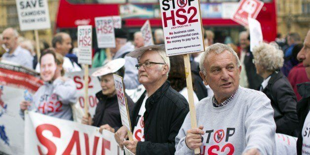 Protesters demonstrate against the government's proposed High Speed 2 (HS2) rail line outside the Houses of Parliament in London on April 28, 2014, as the plans get debated in the House of Commons. Construction of the first stage of the HS2 project, linking London to Birmingham, is proposed to begin in 2017, with the second phase of the scheme then going north to Manchester and Leeds. The full HS2 link between London, the Midlands and the North of England is expected to cost Â£42.6 billion, wh