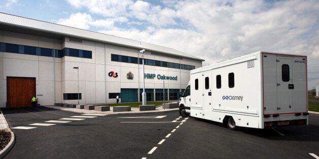 Prisoners are driven to the new prison HMP Oakwood, north of Wolverhampton today.