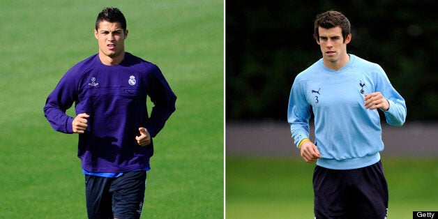 (FILES) Real Madrid's Portuguese forward Cristiano Ronaldo (L) and Tottenham's Gareth Bale take part in training sessions. Tottenham manager Harry Redknapp is hopeful Gareth Bale will be fit to face Real Madrid in the Champions League quarter-final first leg on April 5, 2011 as is Mourinho hoping that his Portuguese star will manage to start. AFP PHOTO / PIERRE-PHILIPPE MARCOU (Photo credit should read PIERRE-PHILIPPE MARCOU/AFP/Getty Images)