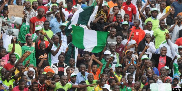 Nigerian players celebrate with the crowd after their 2014 African Nations Championship (CHAN) qualification football match against Ivory Coast on July 6, 2013 in Kaduna. Nigeria defeated Ivory Coast 4 - 1. AFP PHOTO/PIUS UTOMI EKPEI (Photo credit should read PIUS UTOMI EKPEI/AFP/Getty Images)