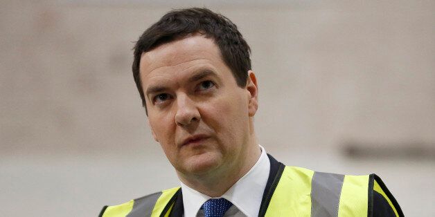 George Osborne, U.K. chancellor of the exchequer, pauses during a tour of Sertec Group Holdings Ltd.'s automotive manufacturing facilities, in Birmingham, U.K., on Monday, Jan. 6, 2014. Osborne set out his plan to ease the burden on families while reiterating his goal to shrink the deficit as he says tax cuts will have to be funded by spending reductions. Photographer: Jason Alden/Bloomberg via Getty Images