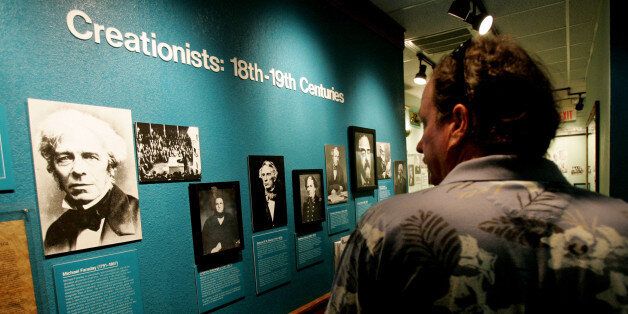 SANTEE, CA - AUGUST 10: A visitor checks out a display of creationists at the Museum of Creation and Earth History August 10, 2005 in Santee, California. The museum contains exhibits that depict the story of Creationism and refute the theory of Evolution. (Photo by Sandy Huffaker/Getty Images)