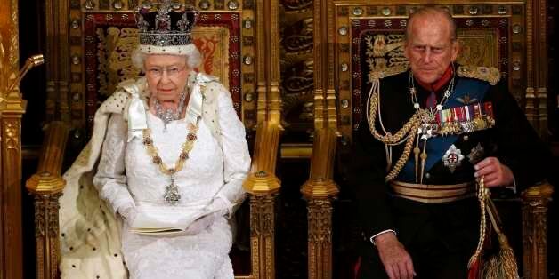 Britain's Queen Elizabeth sits with Prince Philip as she delivers her speech in the House of Lords, during the State Opening of Parliament at the Palace of Westminster in London June 4, 2014. REUTERS/Suzanne Plunkett (BRITAIN - Tags: ENTERTAINMENT POLITICS SOCIETY ROYALS TPX IMAGES OF THE DAY)