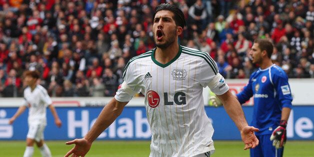 FRANKFURT AM MAIN, GERMANY - MAY 03: Emre Can of Leverkusen celebrates his team's second goal during the Bundesliga match between Eintracht Frankfurt and Bayer Leverkusen at Commerzbank Arena on May 3, 2014 in Frankfurt am Main, Germany. (Photo by Alex Grimm/Bongarts/Getty Images)