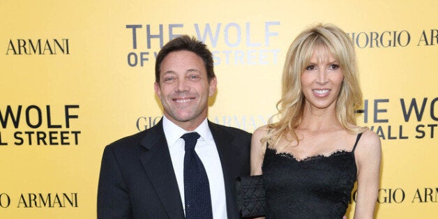 NEW YORK, NY - DECEMBER 17: Jordan Belfort and guest attend the 'The Wolf Of Wall Street' premiere at Ziegfeld Theater on December 17, 2013 in New York City. (Photo by Rob Kim/Getty Images)