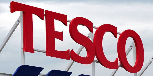 File photo dated 01/08/12 of a Tesco sign as the supermarket chain reported a fresh dip in quarterly sales.