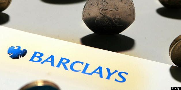 A Barclays bank leaflet is pictured with coins in London, on August 7, 2008. British bank Barclays said Thursday that net profit slumped 35 percent in the first half, hit by write-downs of 2.1 billion dollars (1.4 billion euros) from the US subprime housing and credit crises. Barclays, the third-biggest British bank by market value, said in its results statement that profit after tax had tumbled to 1.72 billion pounds (2.17 billion euros, 3.35 billion dollars) in the first half compared with the